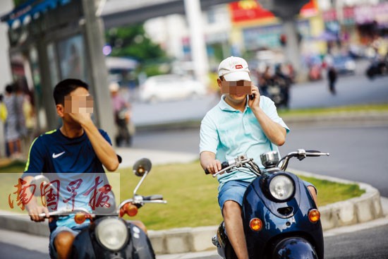 南宁明确规定:骑电动车打电话、撑雨伞罚50元
